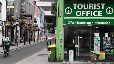 A Deliveroo delivery cyclist passes by a closed tourist information office in Dublin. Former Ryanair chief operating officer Michael Cawley resigned from his role as chief executive of the Irish tourism authority, Failte Ireland, after holidaying in Italy against government advice to avoid non-essential travel abroad. Bloomberg