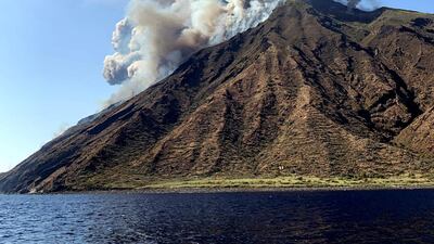 Ash rises into the sky after a volcano eruption on a small island of Stromboli, Italy. According to reports, the island of Stromboli was hit by a set of violent volcano eruptions spurring beach tourists to take into the sea. Two new lava spouts are creeping down the volcano. EPA