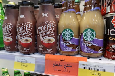 A sign reading: 'Warning: This product is boycotted. The choice is yours. ' is seen at a supermaket in Amman. Reuters