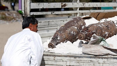 An official inspects unexploded bombs and explosive devices that were seized from a Taliban insurgent last night in Kabul, Afghanistan, October 15, 2017. Omar Sobhani / Reuters