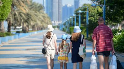 A stroll in the sunshine along the Corniche. Khushnum Bhandari / The National