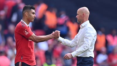 Manchester United manager Erik ten Hag consoles Casemiro after the defeat to Manchester City in the FA Cup final at Wembley on Saturday, June 3, 2023. AFP