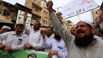 Pakistani traders rally in Peshawar in support of the Pakistani Army after violent protests by the supporters of former prime minister Imran Khan. EPA