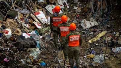 The collapse sent tonnes of refuse onto a nearby waste processing centre, trapping dozens of workers. Getty Images