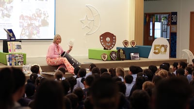 Pupils watch as Ms Brady reveals the contents. Chris Whiteoak / The National