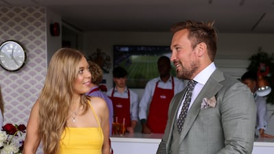 British singer Becky Hill, left, and former rugby player Paul Doran-Jones attend Pimm's No 1 hospitality suite. Getty Images for Pimm's
