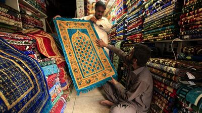 People buy prayer mats ahead of Ramadan, in Peshawar, Pakistan. EPA