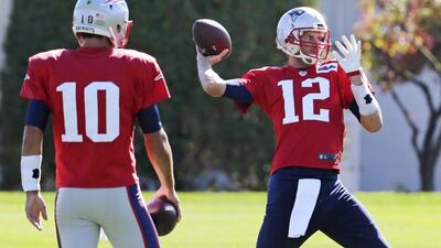 New England Patriots quarterback Tom Brady throws a pass during practice on Wednesday ahead of their NFL game against the Dallas Cowboys on Sunday. Charles Krupa / AP / October 7, 2015