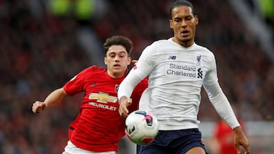 Liverpool's Virgil van Dijk in action with Manchester United's Daniel James. Reuters