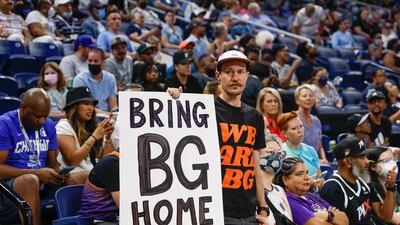 A man holds a sign for Brittney Griner Home during the first half of the WNBA game between the Chicago Sky and Phoenix Mercury at Wintrust Arena in Chicago, Illinois. EPA