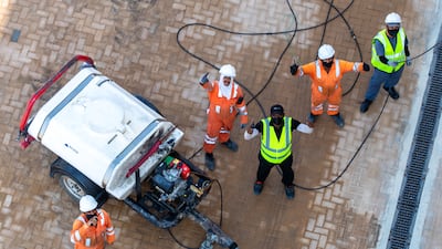 Workers get the grandstand ready for the grand prix that will be held from December 9 to 12. Victor Besa / The National