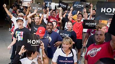 Basketball fans cheer for LeBron James in Cleveland, part of a campaign by the Cavaliers to keep the player with the team.