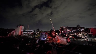 A car flipped over by strong winds. AP Photo
