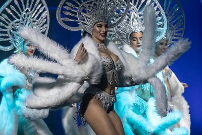 Performers don hand-made headpieces and customised costumes. Antonie Robertson / The National