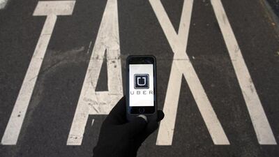 The San Francisco-based company has opened offices in 54 countries, including the UAE and India. Above, a subscriber in Madrid using Uber. Sergio Perez / Reuters