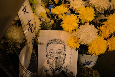 A card with a portrait of Dr. Li Wenliang at Li's hospital in Wuhan in central China's Hubei province, February 7, 2020 (re-issued 22 January 2021). Dr Li, regarded a whistleblower on the pneumonia outbreak, died of the novel coronavirus on late February 7, 2020. EPA