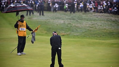 US golfer Brian Harman holes his putt on the 18th green to win the 151st Open Championship. AFP