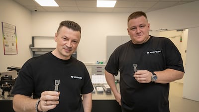 Valentyn Volkov and Roman Axelrod, right, co-founders of Xpanceo, with prototypes of their smart contact lenses at their laboratory in Dubai. Antonie Robertson / The National