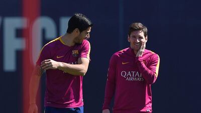 Barcelona’s Argentinian forward Lionel Messi (R) and Barcelona’s Uruguayan forward Luis Suarez (L) take part in a training session at the FC Barcelona Joan Gamper Sports Centre in Sant Joan Despi, near Barcelona on April 16, 2015, on the eve of the Spanish League match FC Barcelona v Valencia CF. AFP / LLUIS GENE