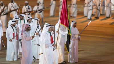 Lt Genl Sheikh Saif bin Zayed, Deputy Prime Minister and Minister of Interior (C) and Sheikh Ammar bin Humaid, Crown Prince of Ajman (centre L) dance during the 44th UAE National Day celebrations at Zayed Sports City. Mohamed Al Hammadi / Crown Prince Court - Abu Dhabi