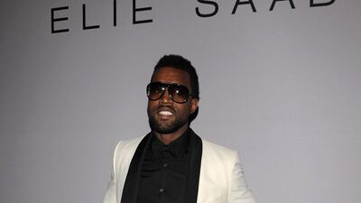 Kanye West, in retro tailoring, attends Elie Saab fashion show during on January 28, 2009 in Paris, France. Getty Images