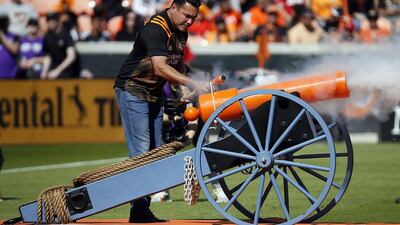 Houston Dynamo minority owner and former world boxing champion Oscar De La Hoya fires a canon to start the Major League Soccer game against the Los Angeles Galaxy at BBVA Stadium in Houston, on Saturday, February 29. Getty