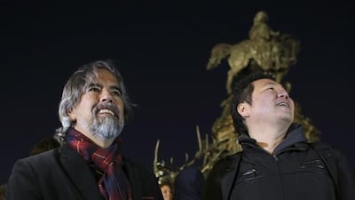 Frank Lee, right, a Drexel University game-design professor, and game designer Henk Rogers, centre, play Tetris on the 29-story Cira Centre in Philadelphia. Joseph Kaczmarek / AP Photo