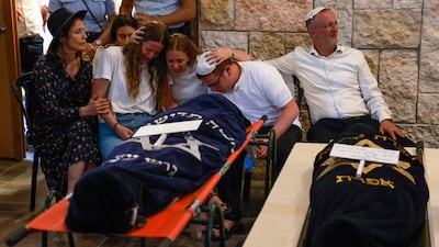 Relatives at the funeral of British-Israeli sisters Rina and Maya Dee at the Kfar Etzion settlement cemetery in the occupied West Bank. AFP