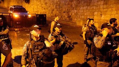 Israeli border guards stand outside Lions' Gate at the Al Aqsa mosque compound on Friday. Ahmad Gharabli / AFP
