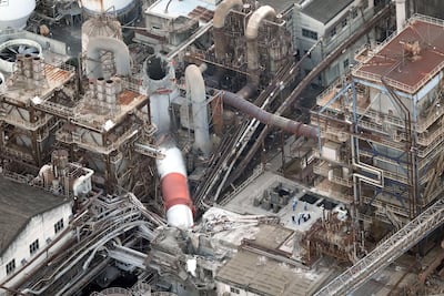 An aerial view shows a collapsed chimney at Nippon Paper Industries' Yatsushiro Mill. Kyodo / via Reuters