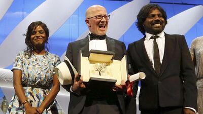 From left, Dheepan actor Kalieaswari Srinivasan, director Jacques Audiard and actor Antonythasan Jesuthasan with the Palme d’Or at the 68th Cannes Film Festival. Regis Duvignau / Reuters