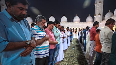 Isha prayers held at the mosque. Victor Besa / The National