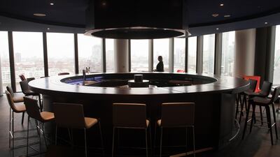 A person walks around the bar prior to the unveiling of the new US Embassy building in Nine Elms in Wandsworth, London. Stefan Rousseau - WPA Pool / Getty Images