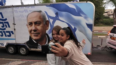 An election campaign bandwagon and a chance for a selfie as Benjamin Netanyahu aims to return Likud to power. AFP