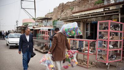 Pedestrians at a market the city of Kirkuk, the provincial capital of Kirkuk governorate. Ali Arkady/Metrography