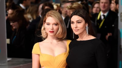 Lea Seydoux, left, wearing Prada, arrives at the British Academy Film Awards with Monica Bellucci on February 8, 2015. EPA