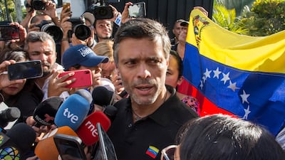 Leopoldo Lopez speaks to the media at the gate of the Spanish ambassador's residence in Caracas. Getty Images