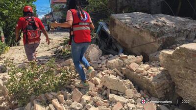 Rescuers manoeuvre along debris in Vigan city, Ilocos Sur province, after the earthquake struck. EPA