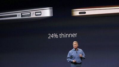 Phil Schiller, senior VP of worldwide marketing for Apple, speaks about Apple's new MacBook. The new device weighs less than 1kg. Robert Galbraith / Reuters