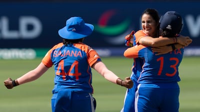 India's Renuka Singh, centre, celebrates the wicket of Pakistan's Gull Feroza with her teammates. AP