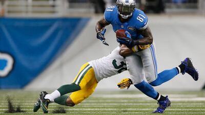 The absence of Calvin Johnson, right, helped quarterback Matthew Stafford and the Detroit Lions look to other players. His return from injury means Stafford and the offence must find a way to reintegrate their star receiver without losing rhythm. Gregory Shamus / AFP