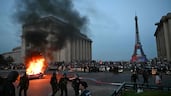 A car burns as Paris Saint-Germain supporters celebrate their team's win in the Uefa Champions League final with Arsenal in Budapest, Hungary, at Place du Trocadero opposite the Eiffel Tower in Paris. AFP