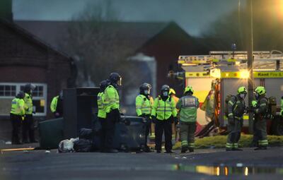 Emergency services attend the fire at Napier Barracks in southern England. AP