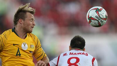 Rhyan Bert Grant, left, of Australia in action against Almawas. EPA