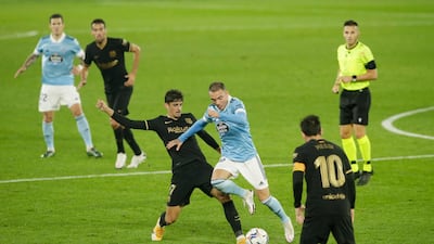 Celta Vigo’s Iago Aspas in action with Barcelona’s Francisco Trincao. Reuters