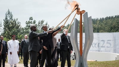 African Union chief Moussa Faki, left, Rwanda's President Paul Kagame and his wife Jeannette, and European Commission President Jean-Claude Juncker light a remembrance flame for the 25th Commemoration of the 1994 Genocide at the Kigali Genocide Memorial in Kigali, Rwanda. AFP
