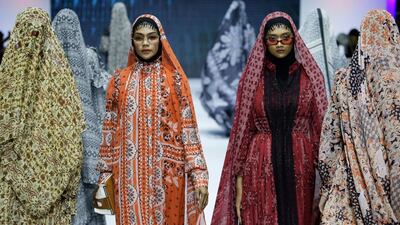 Models display creations by Barli Asmara during the Muslim Fashion Festival in Jakarta, Indonesia. The event was held to greet the upcoming holy fasting month of Ramadan. AP