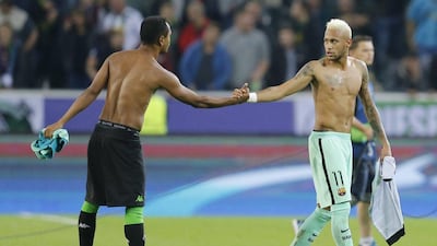 Barcelona’s Neymar, right, and Borussia Monchengladbach’s Raffael greet after exchanging shirts after the Champions League Group C match. Michael Probst / AP Photo