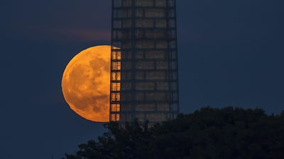 This photo provided by NASA shows a supermoon rises behind the Washington Monument. AFP