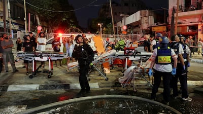Emergency personnel operate after missiles were launched from Iran to Israel, in Tel Aviv, Israel, June 16, 2025. REUTERS / Ronen Zvulun TPX IMAGES OF THE DAY